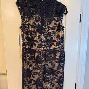 Women’s navy blue cocktail dress with nude underlay, beautiful lace neckline.